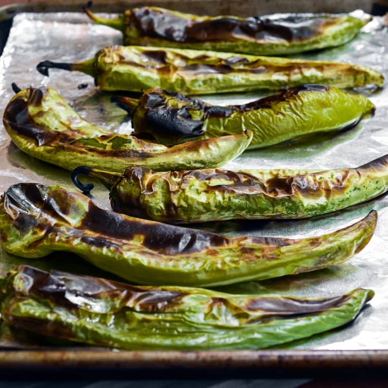 Green chile peppers that have been cooked